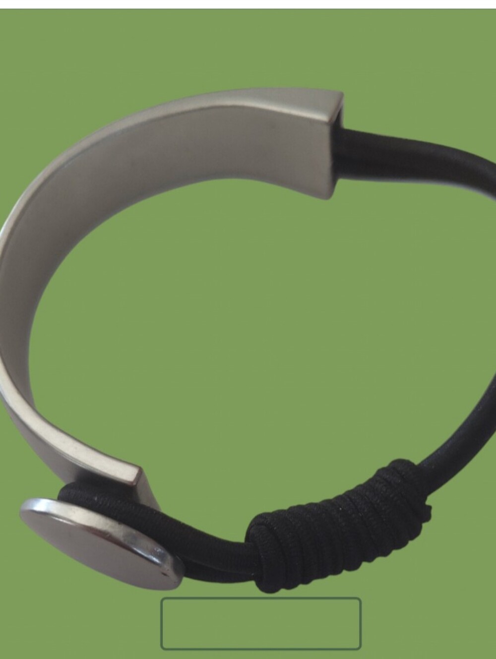 Bracelet with a Silver Tone Band & Black Stretch Cord with a Hoop/Button Closure